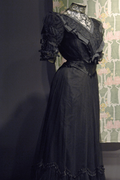 Black 19th century dress with lace bodice and high collar