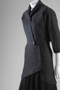 mannequin in a black dress with collared jacket