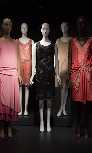 platform view of a group of 1920s evening dresses.